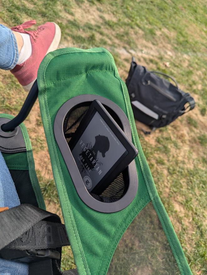 Me reading the Vegetarian at soccer practice